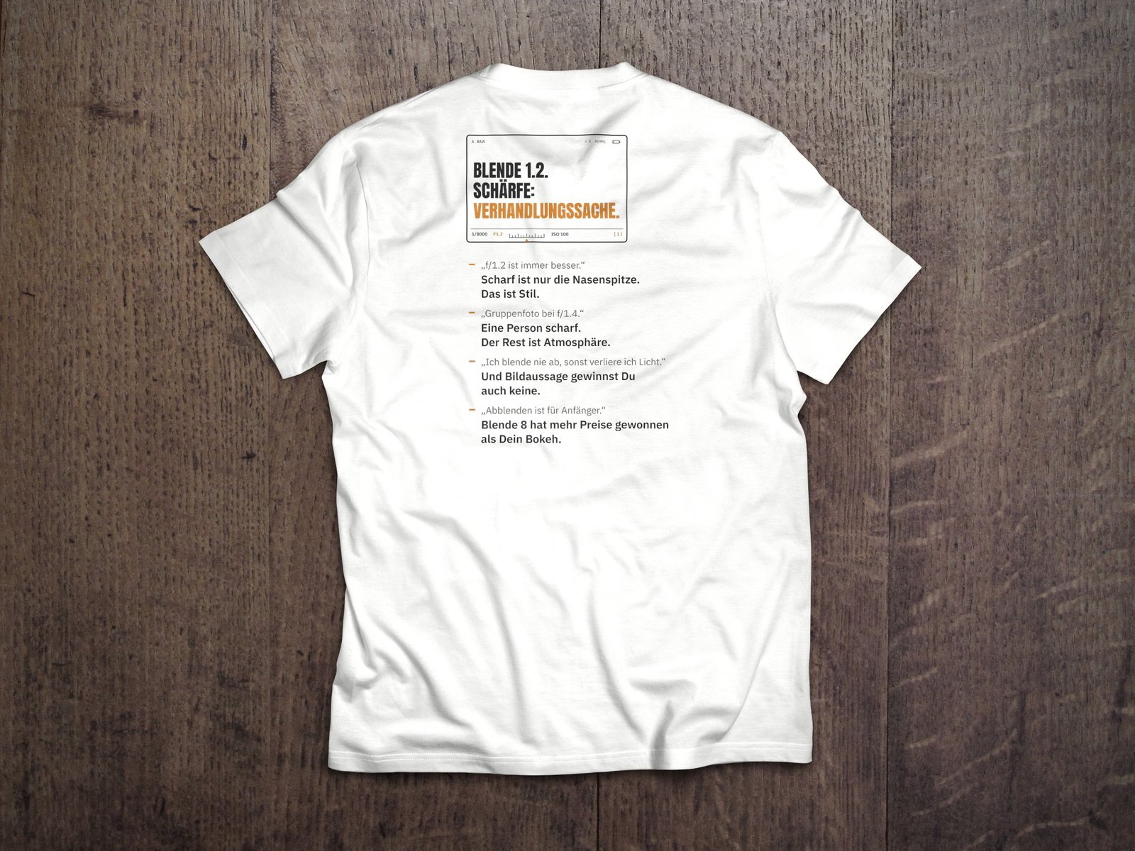Fotografen-T-Shirt «Blende 1.2» von hemmi.photo – Rückendruck auf White